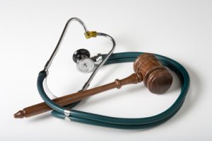Gavel and Stethoscope on white background. Denied Disability Claims